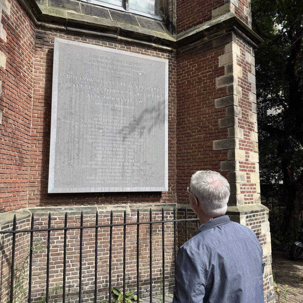 John Boeren looking at the commemorative plaque for the Pilgrims in Leiden.